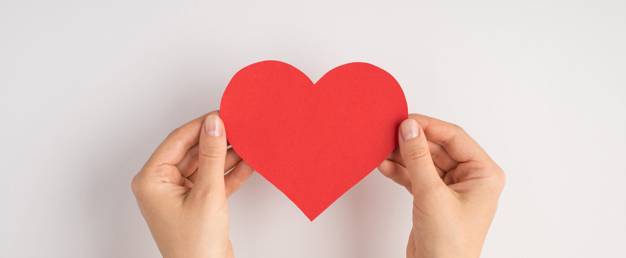 Hands holding a paper heart Keyword: Love Paper Week